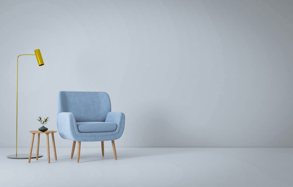 Minimalist Furniture Setup with Expert Furniture Assembly Service Minimalist setup with a blue armchair, yellow floor lamp, and a side table, assembled through a professional furniture assembly service.