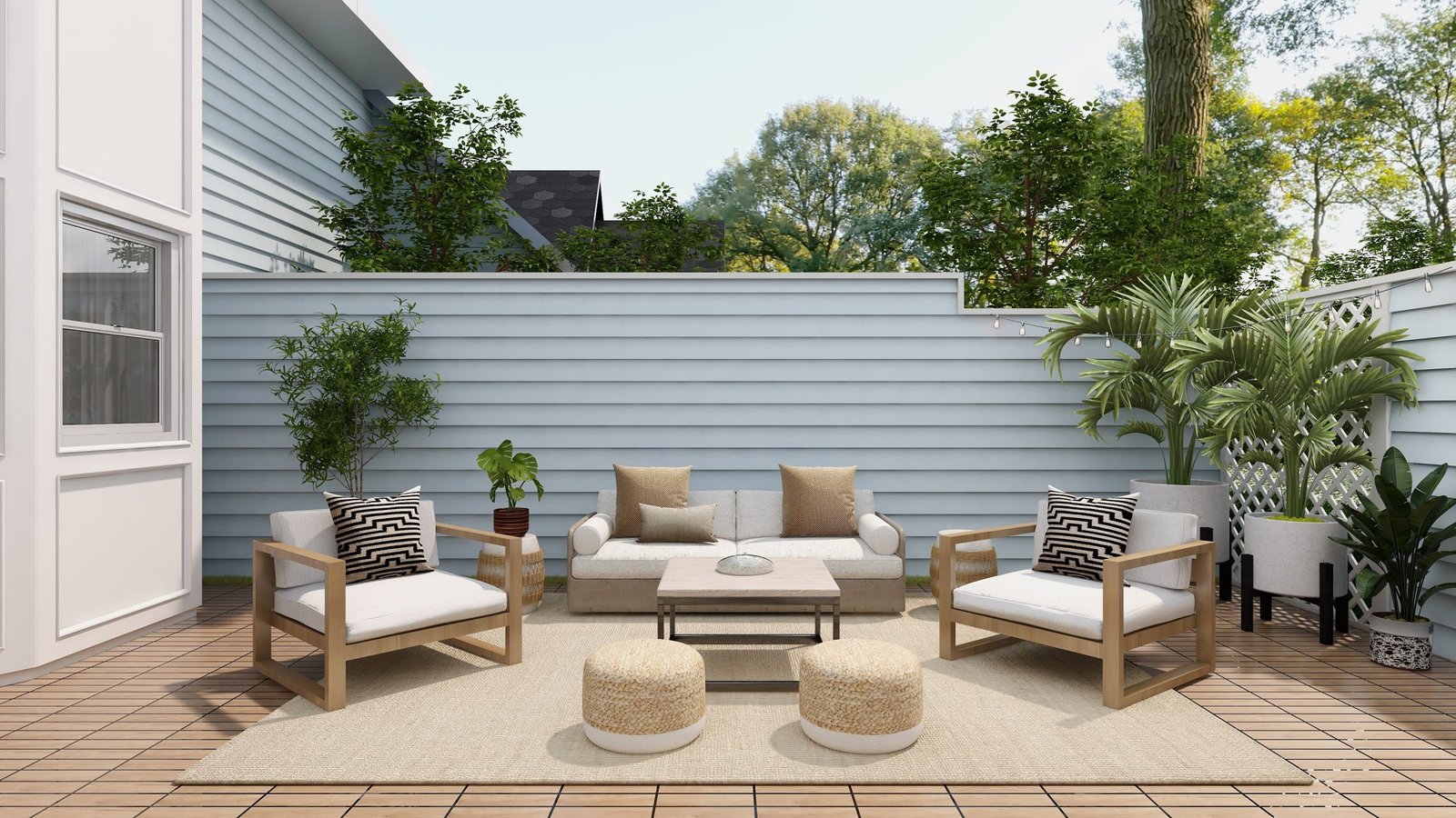 Modern outdoor patio setup with cushioned wooden chairs, a sofa, small tables, poufs, and lush greenery on a wooden deck.